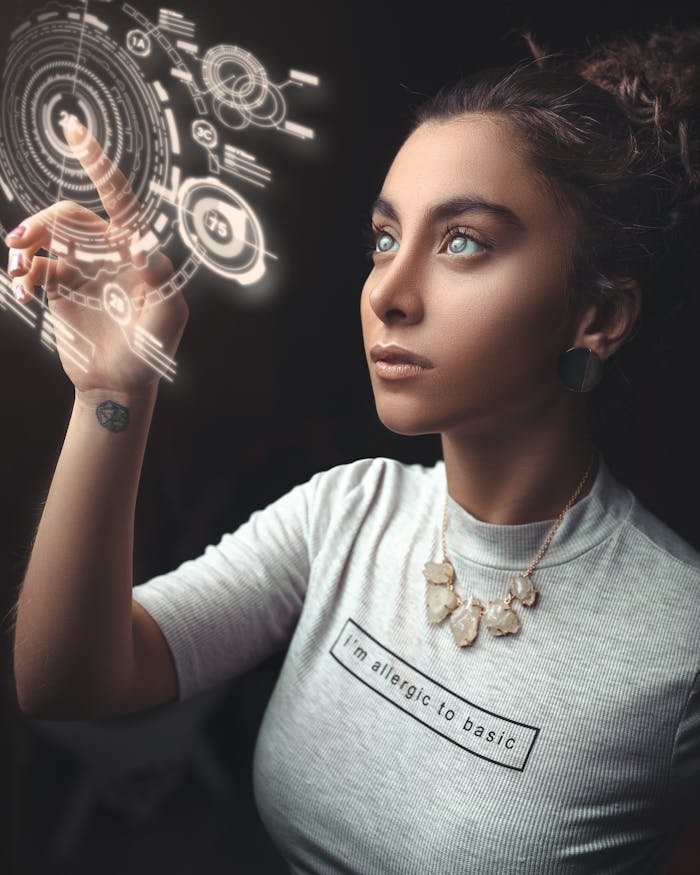 our-services-2 Woman in a modern setting interacting with a holographic user interface. Futuristic concept.